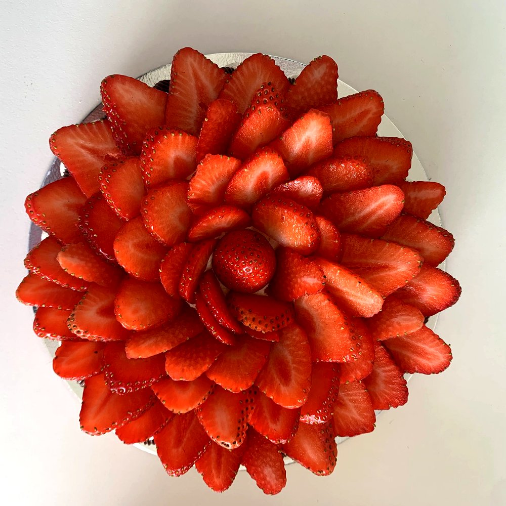 Strawberry Pavlova — A stunning centrepiece built on a crisp meringue base, layered with your choice 